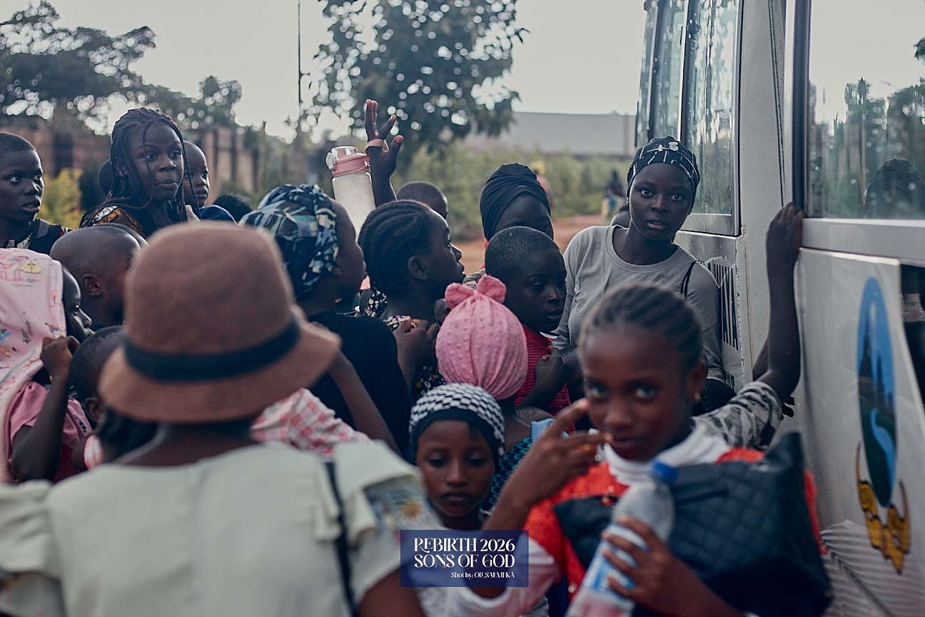 Children gathered beside a bus.