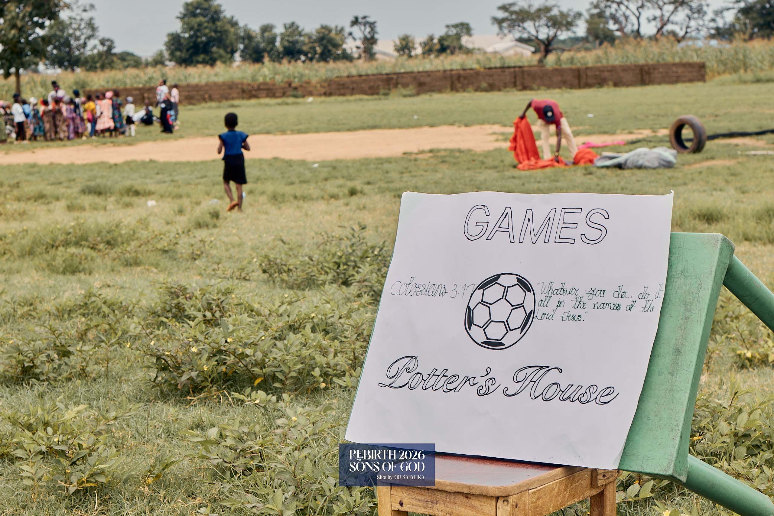 A handmade Games sign beside an outdoor activity area.