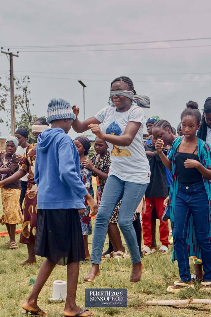 A participant wearing a blindfold during an outdoor group game.