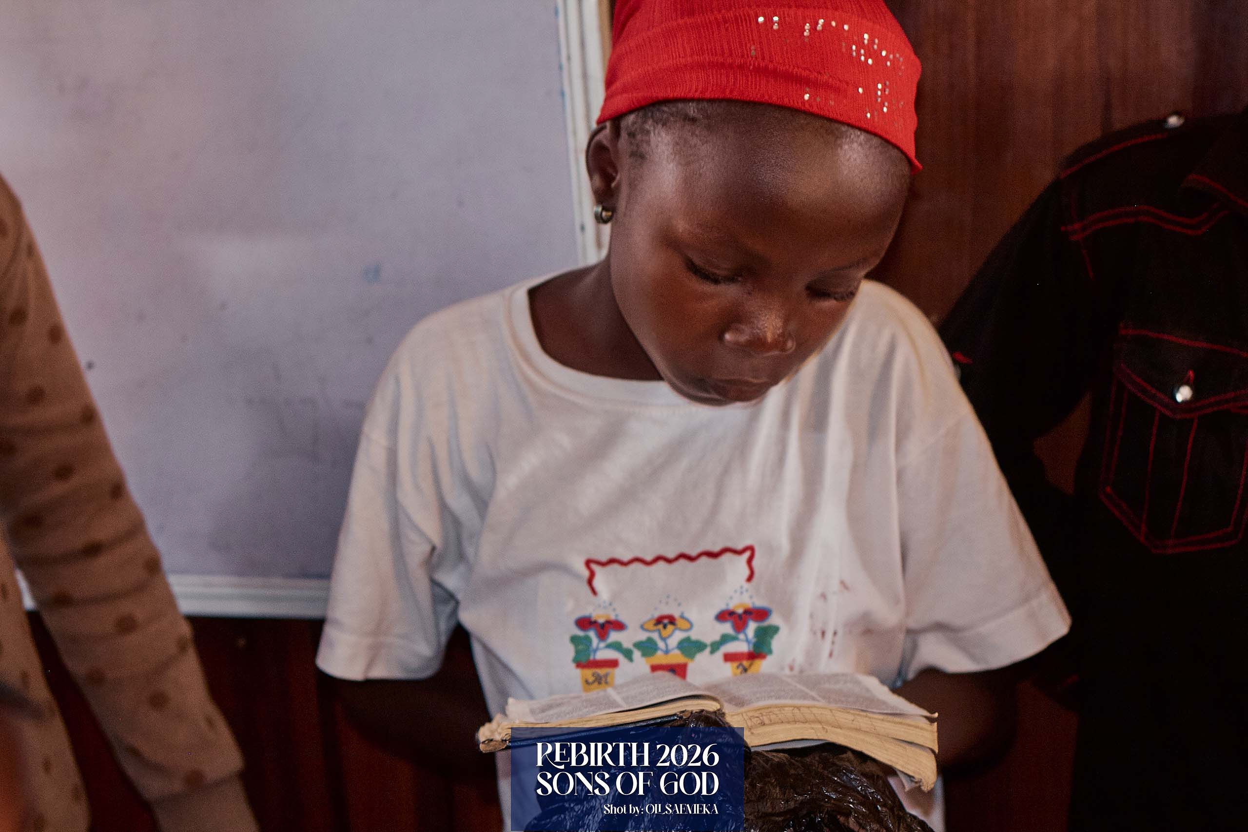 A child reading an open Bible.