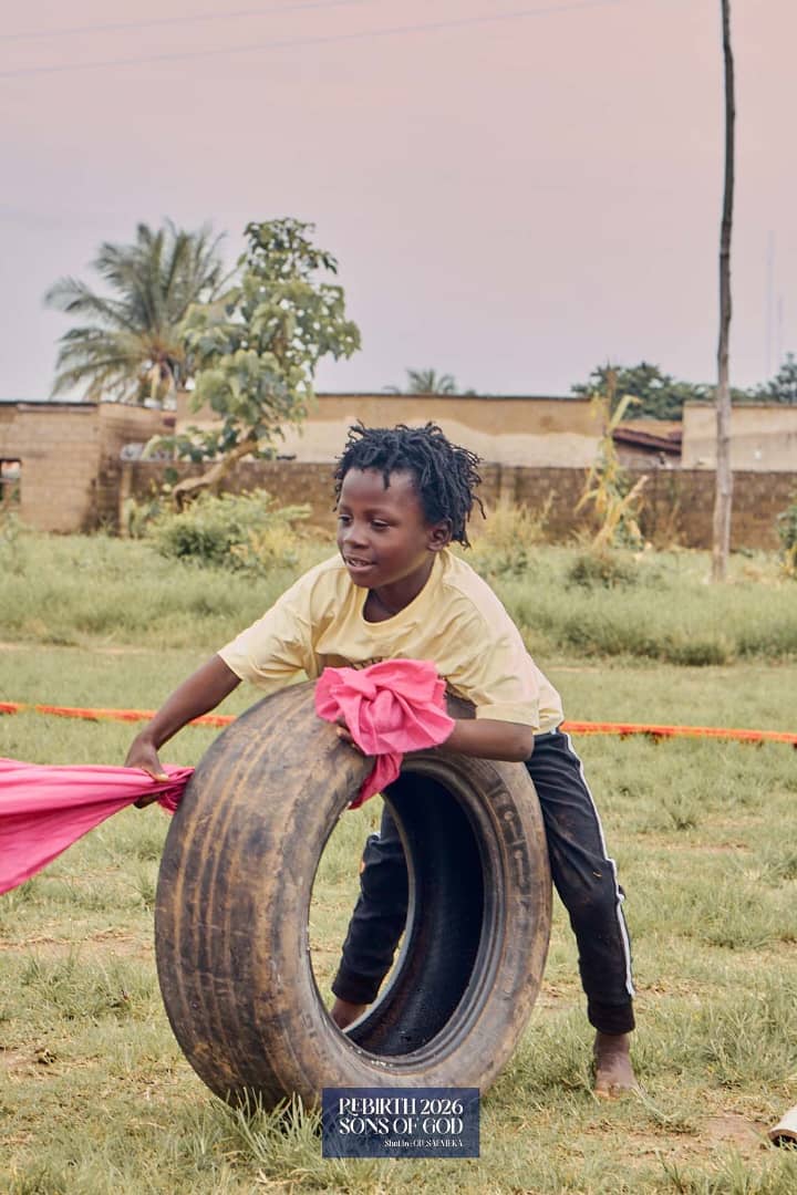 A child taking part in an outdoor tyre activity.